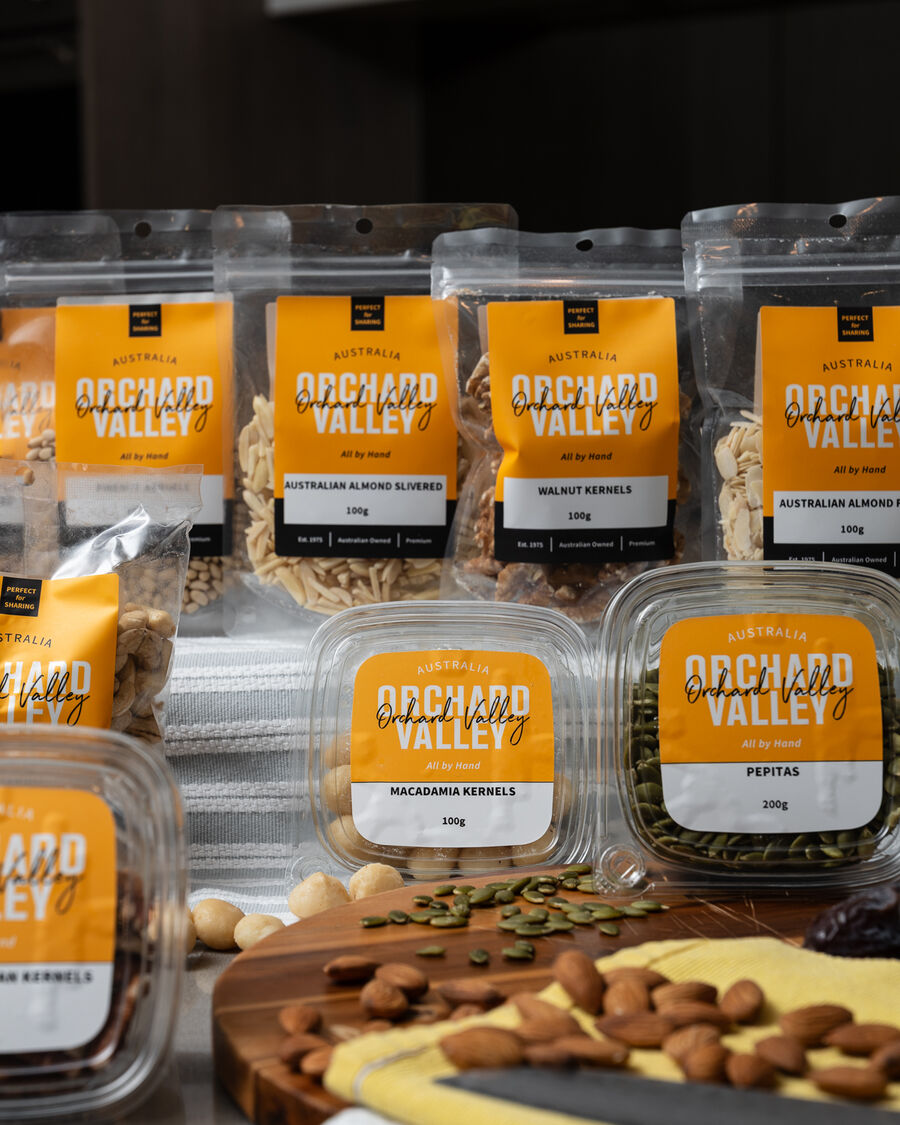 Orchard Valley packets of nuts and seeds on a kitchen bench.