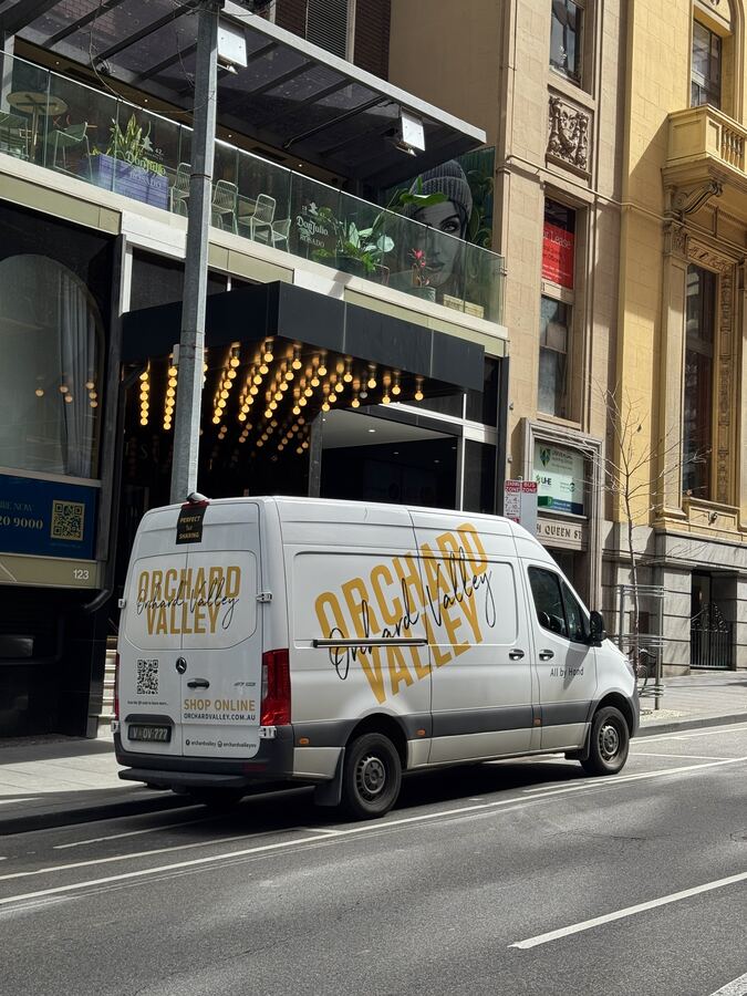An Orchard Valley van parked for a delivery in the city.